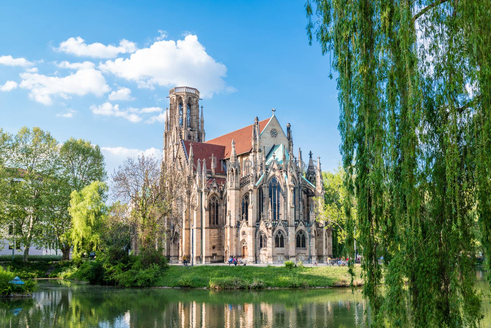 STUTTGART, GERMANY - APRIL 24, 2014: People are enjoying a great sunny spring day around Johanneskirche (St. Johns Church) at Feuersee (fire pond) on April, 24,2014 in Stuttgart, Germany.