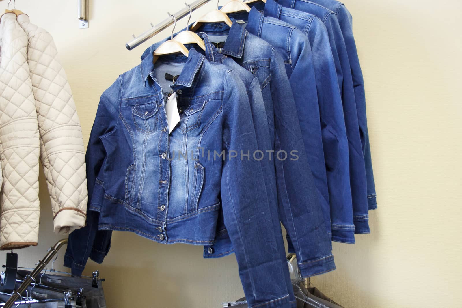 denim jackets hanging in the shop for sale