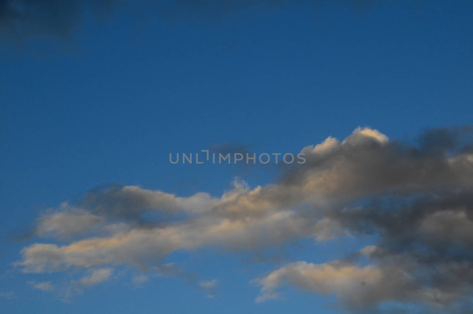 Cloudscape, Colored Clouds at Sunset near the Ocean