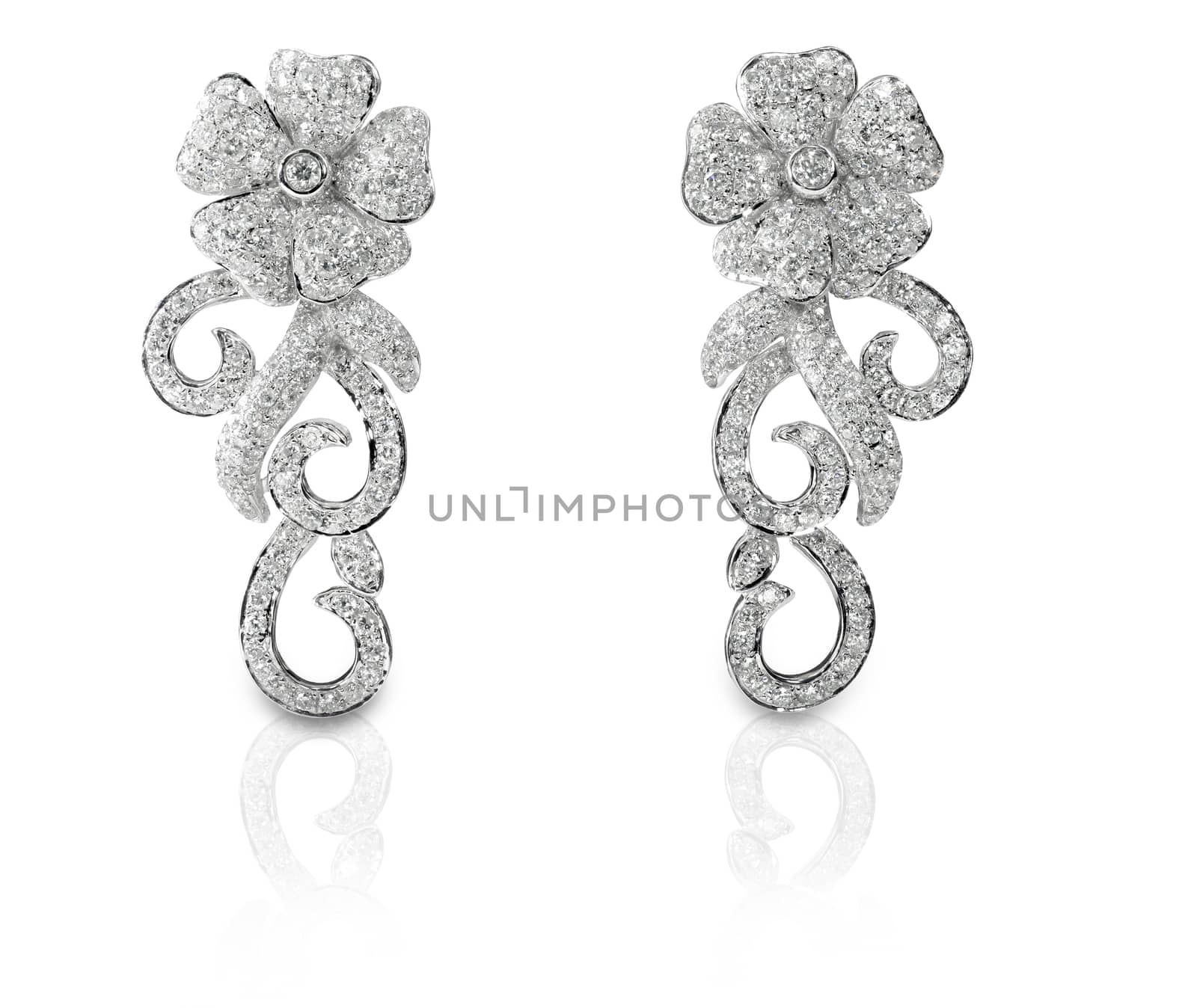 Beautiful floral shaped Diamond pave earrings isolated on white with a reflection