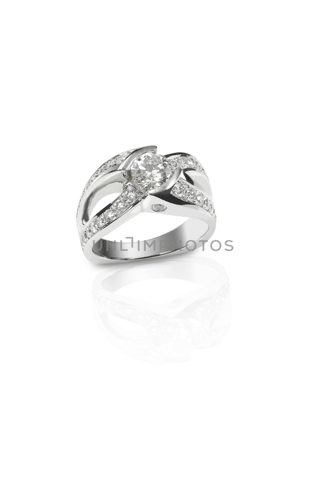 Diamond encrusted engagment wedding anniversary ring isolated on a white background with a reflection