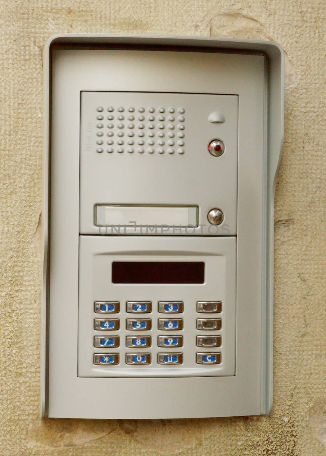 Close-up of building intercom on a wall