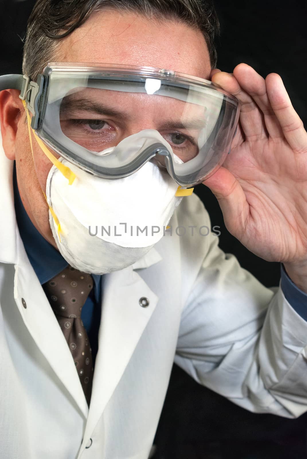 Close-up of a Doctor wearing a mask and goggles.
