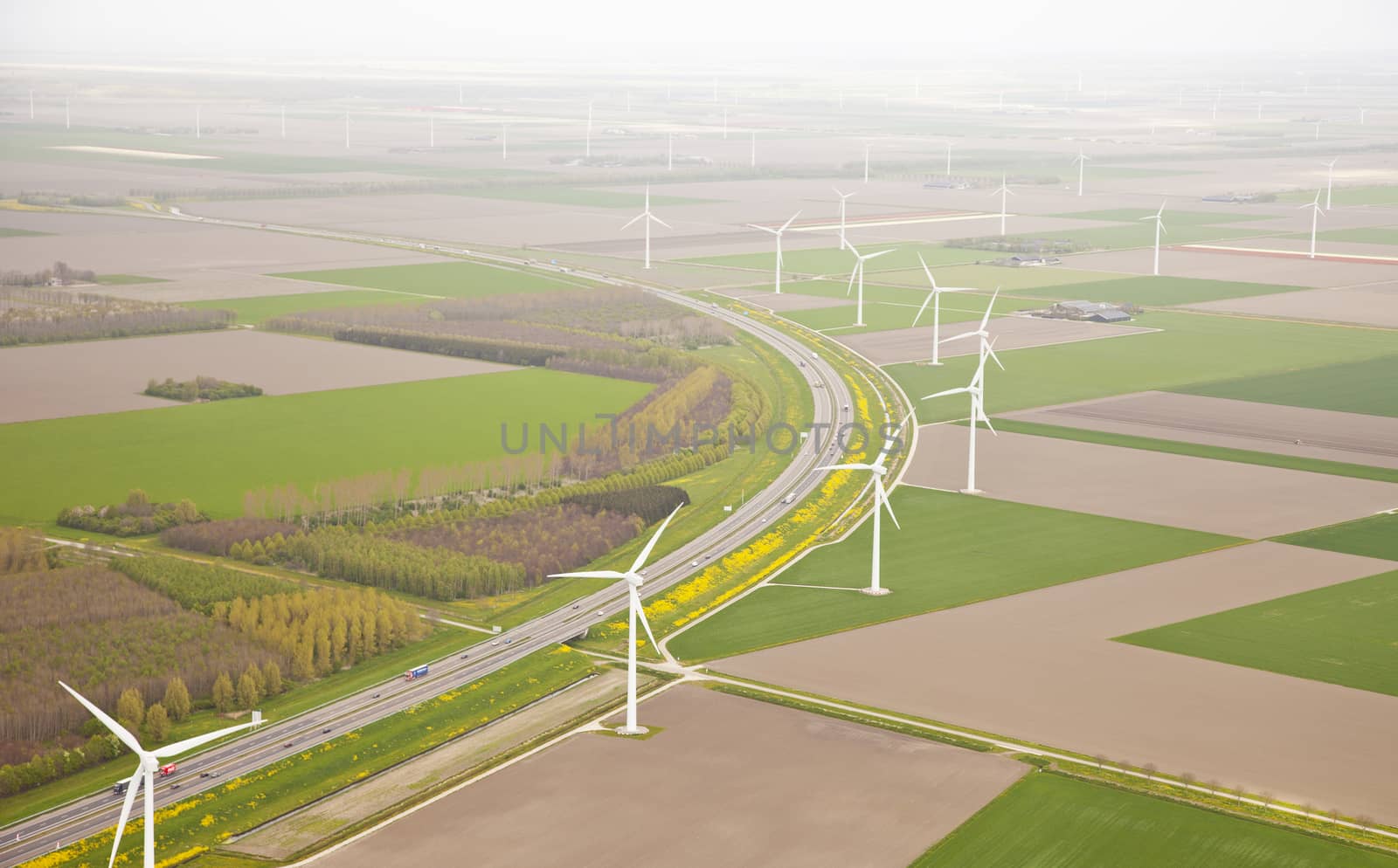 Dutch farm landscape with windmills and road from above, The Netherlands