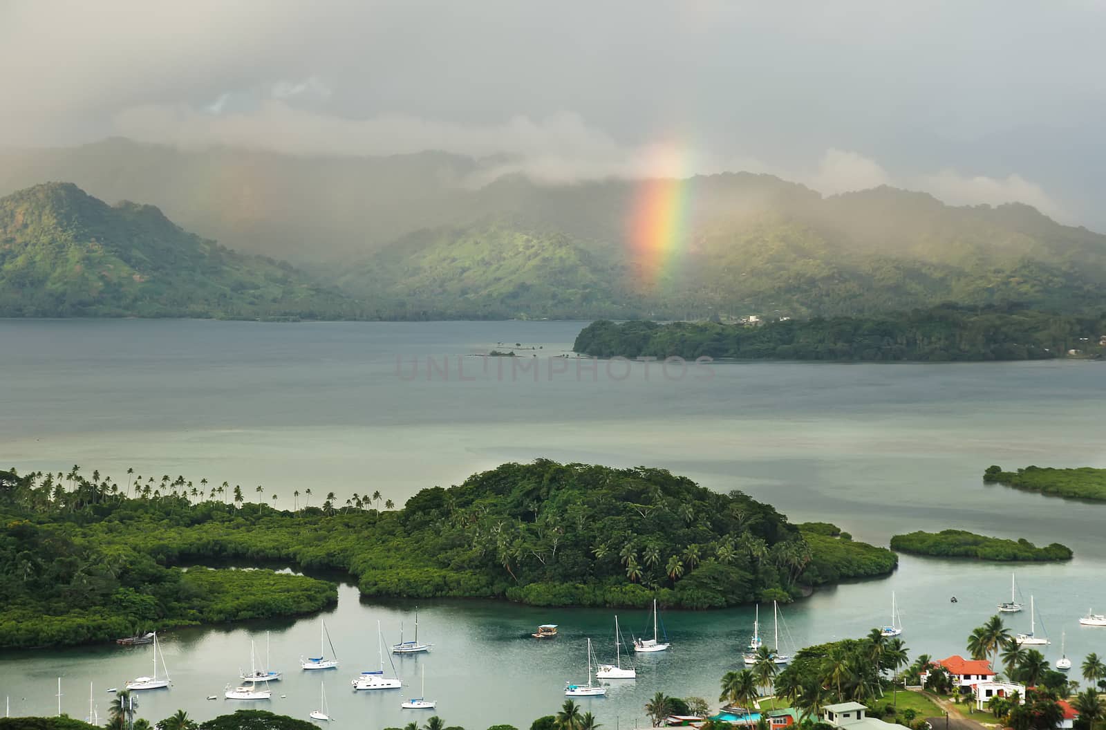 Savusavu marina and Nawi islet with rainbow, Vanua Levu island, Fiji, South Pacific