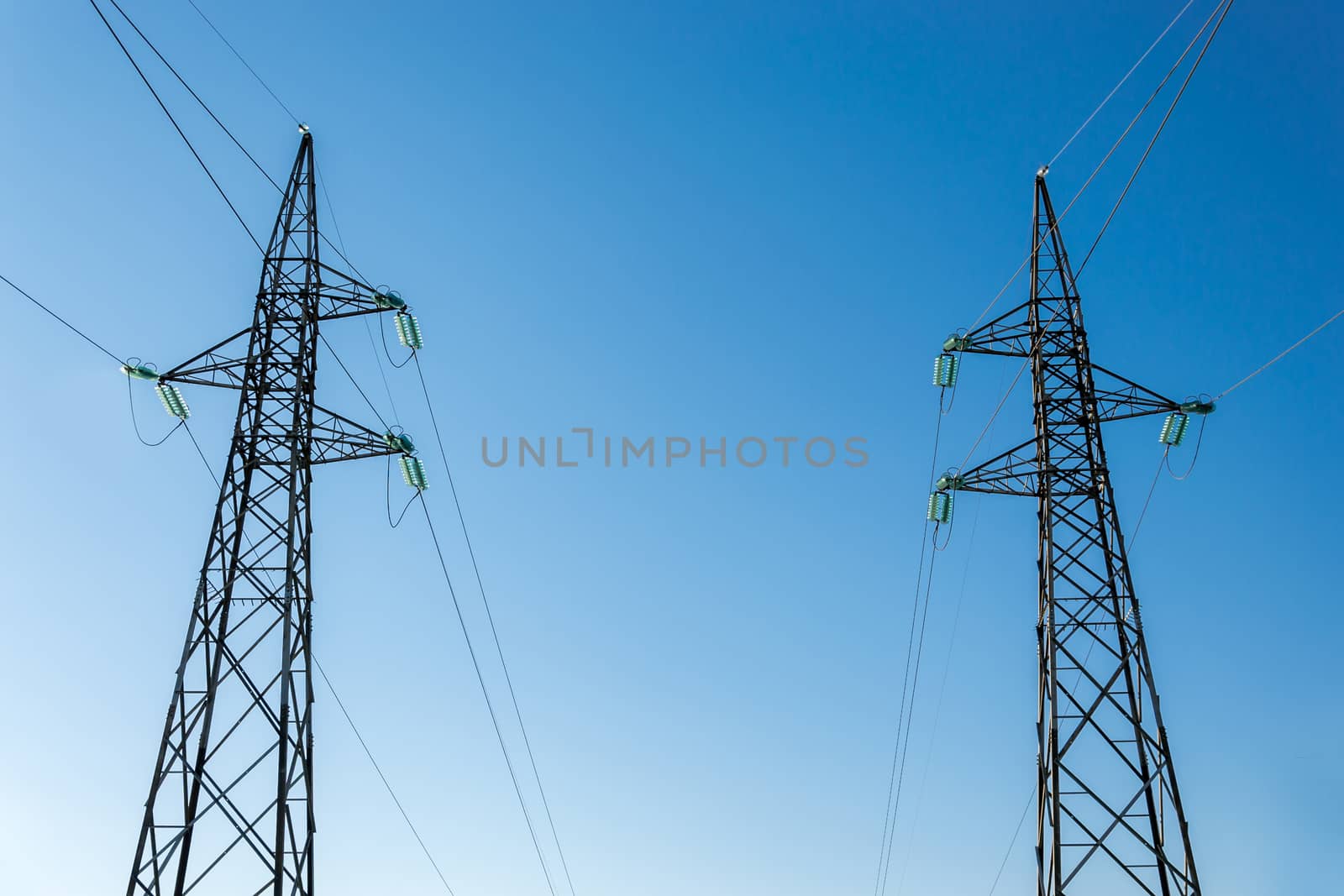 High-voltage electricity pylons, view from below  by enrico.lapponi