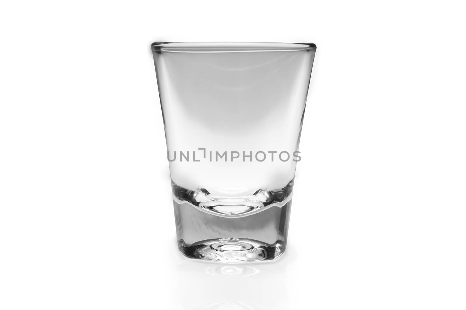 Empty shot glass on white background