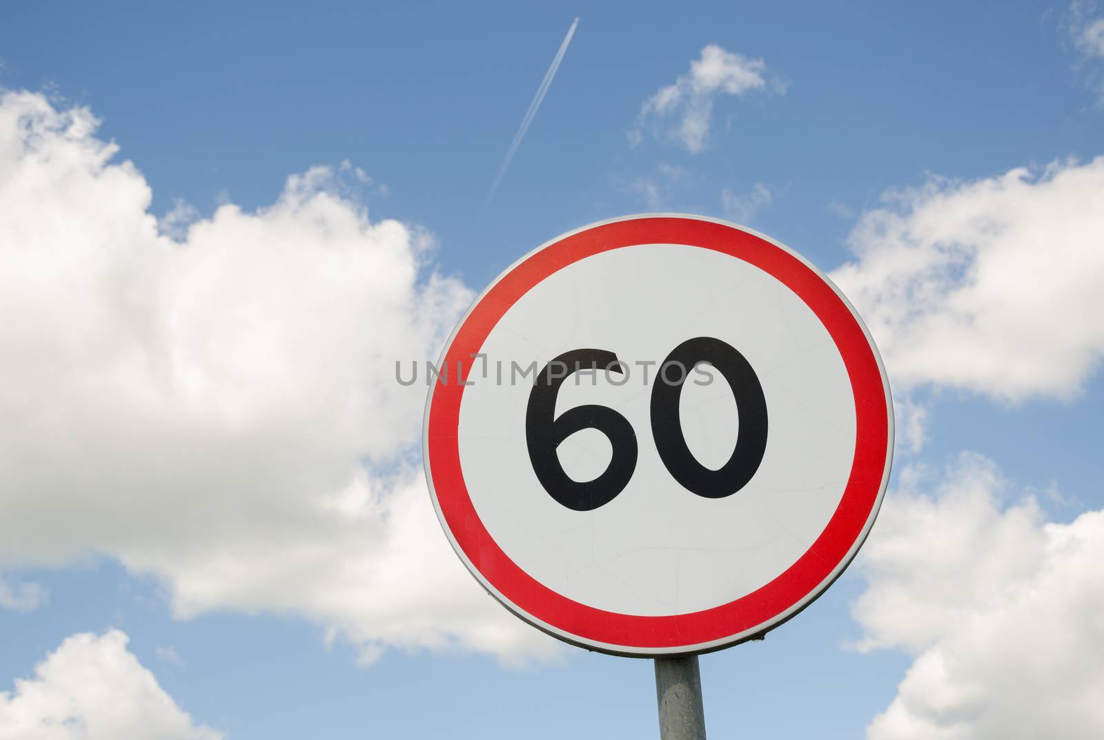 road traffic round sign limiting speed on blue sky background