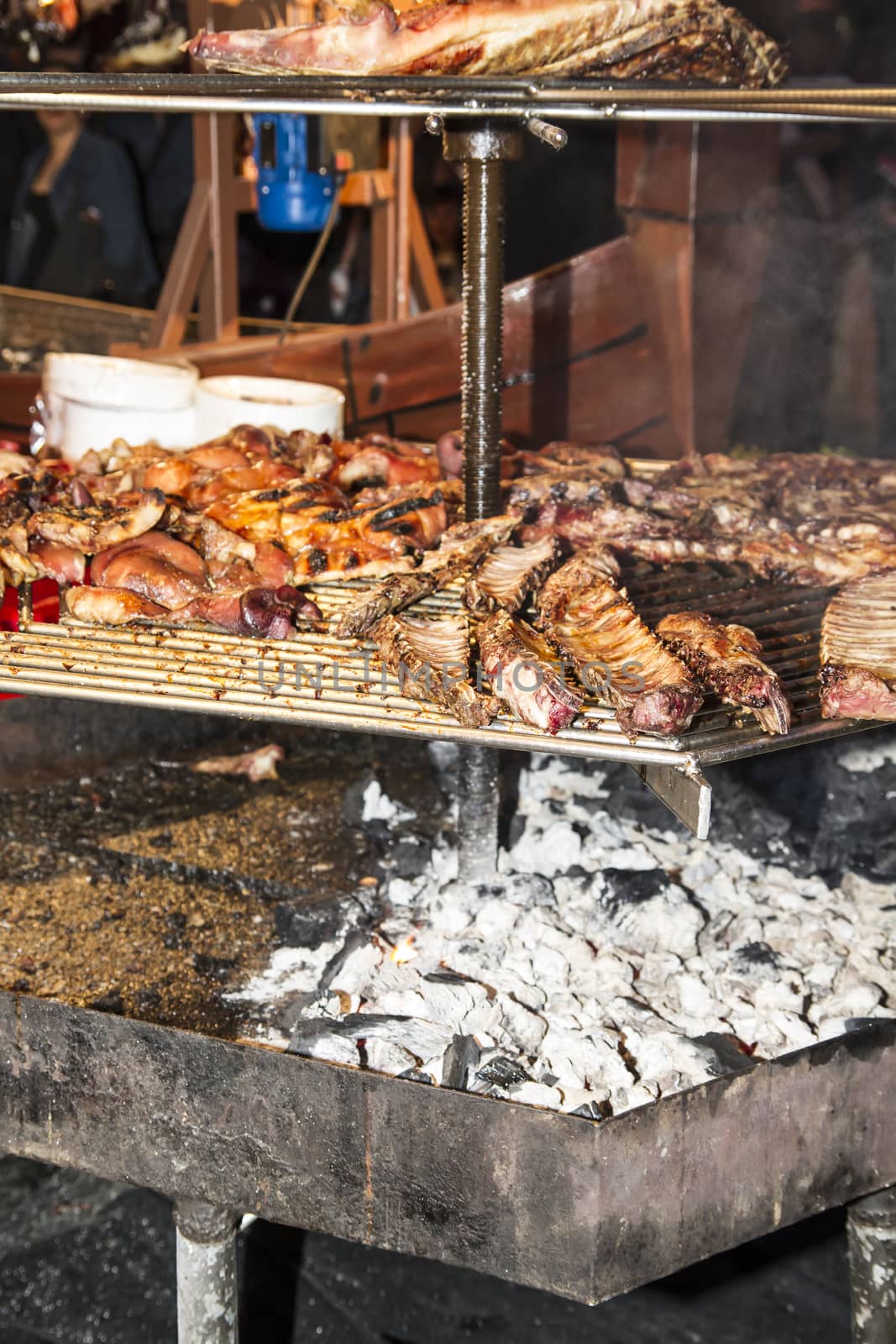barbecue with sausages and lamb in a medieval fair, Spain by FernandoCortes