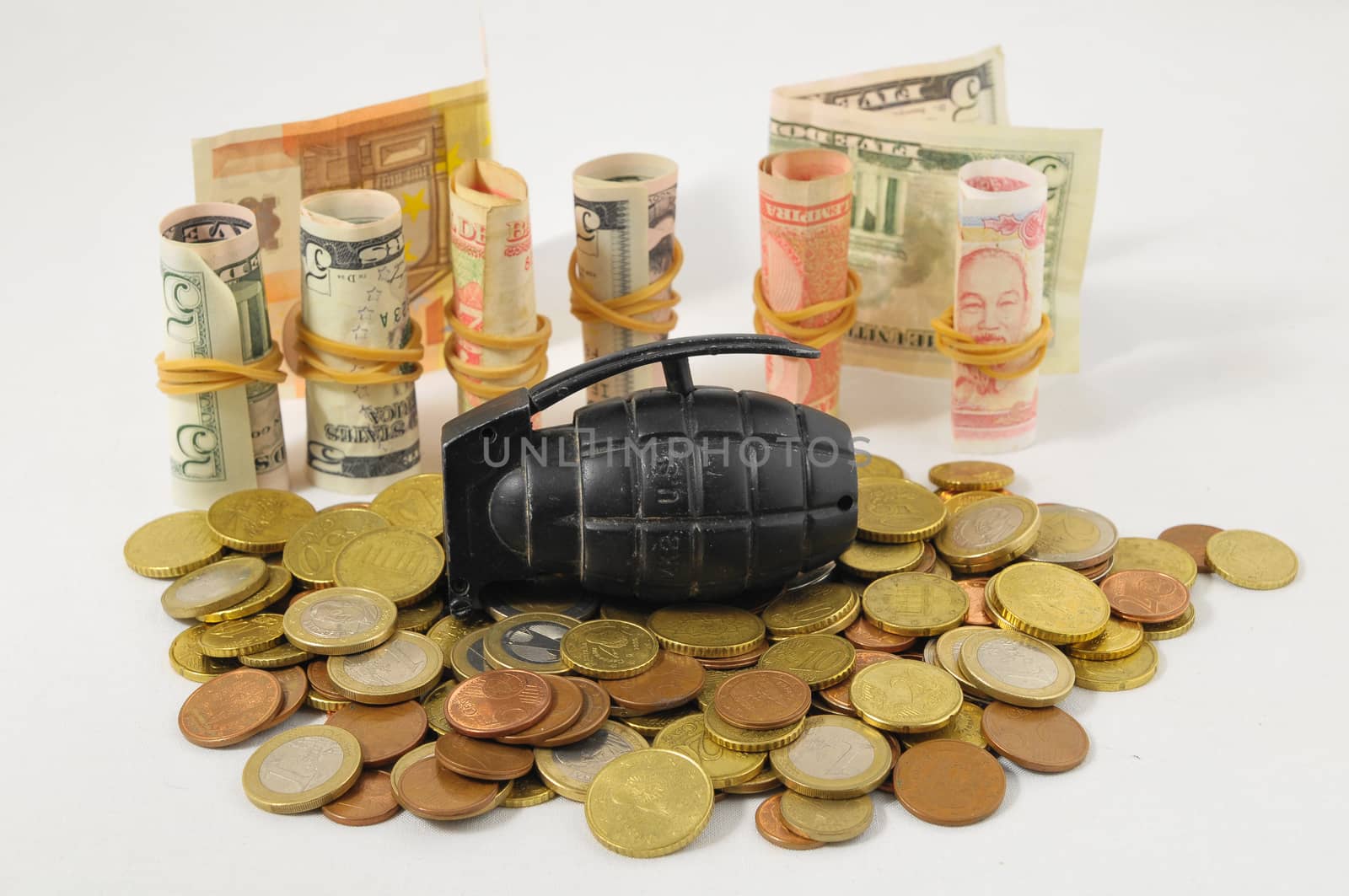 Money for War Concept Hand Grenade and coins