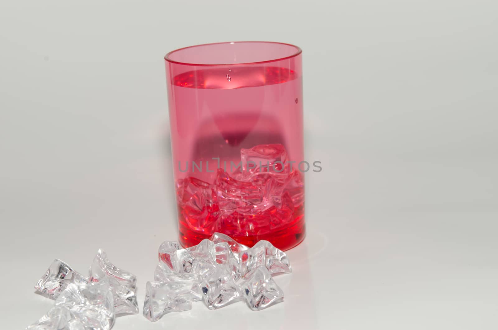 Red plastic cups isolated on white background.