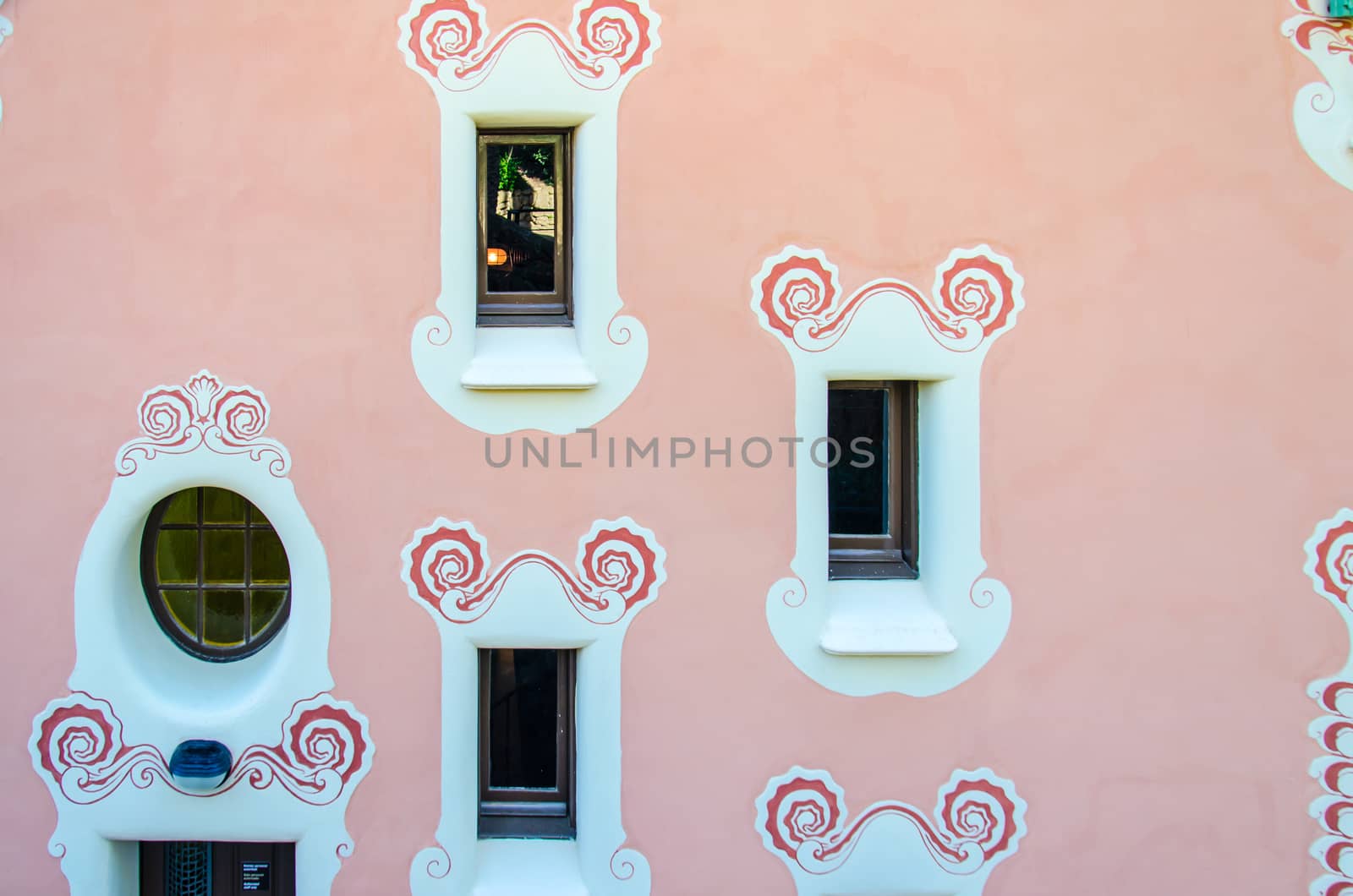 Stylish shaped windows in the walls pink.