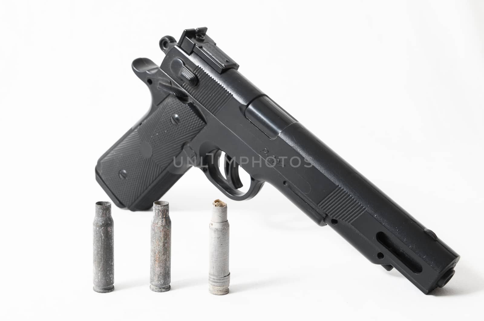 Pistol Gun and Bullets on a White Background