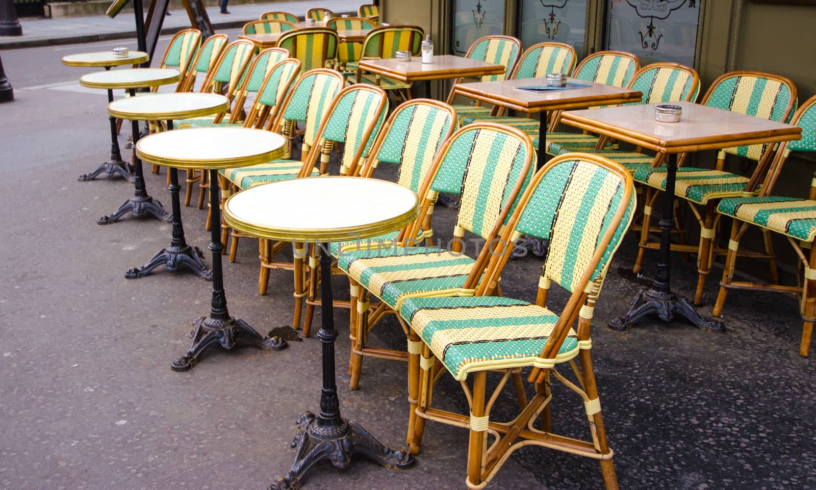 Chairs on the city street of Paris.