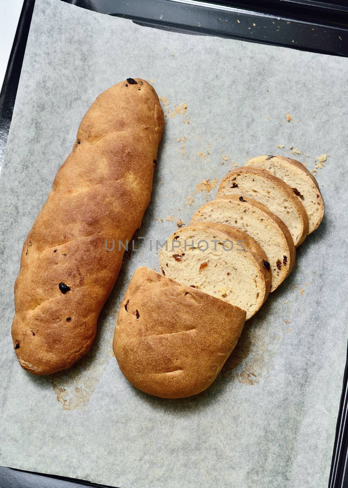 Homemade raisin bread in tray