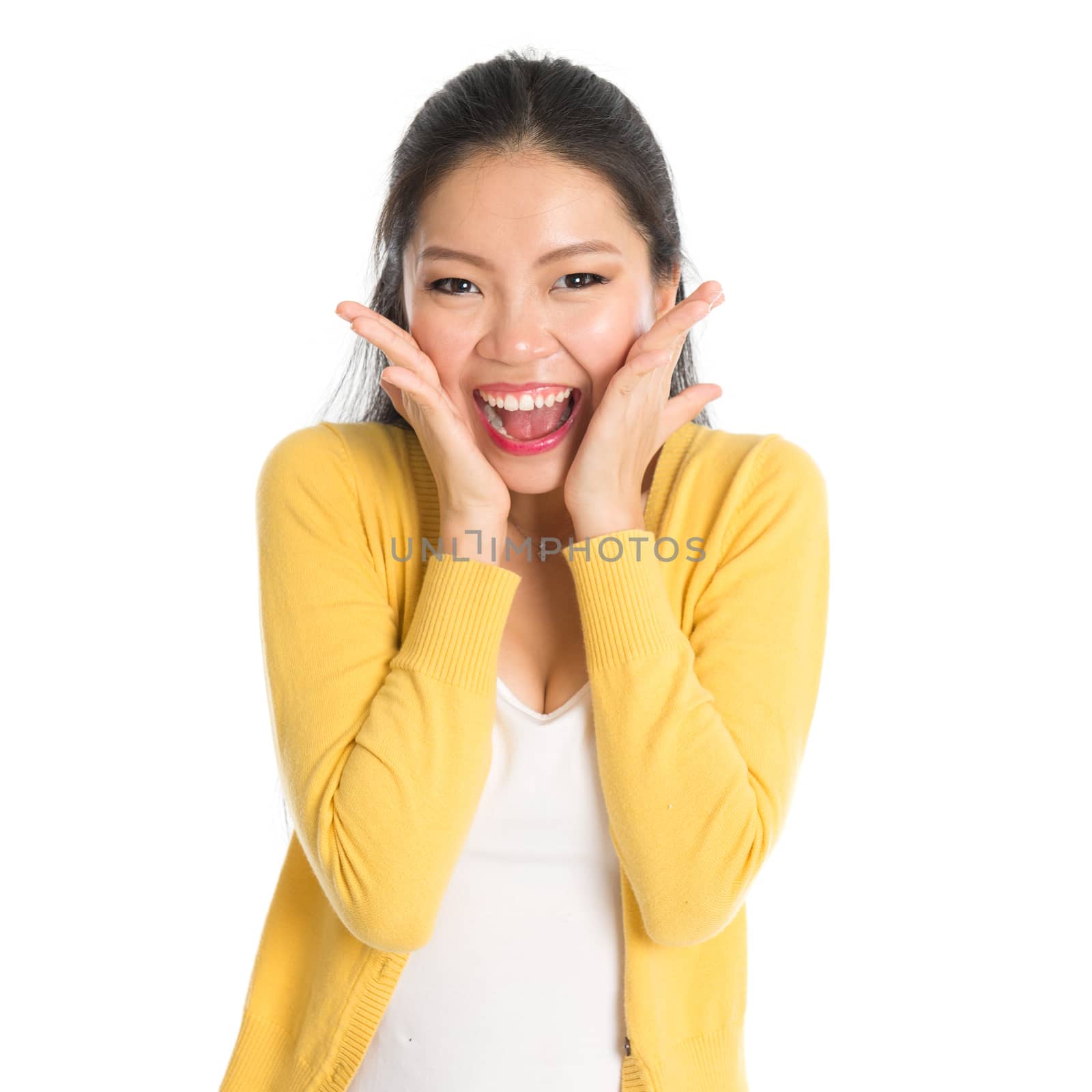 Young Asian girl surprises and shouts out, face expression, isolated on white background.