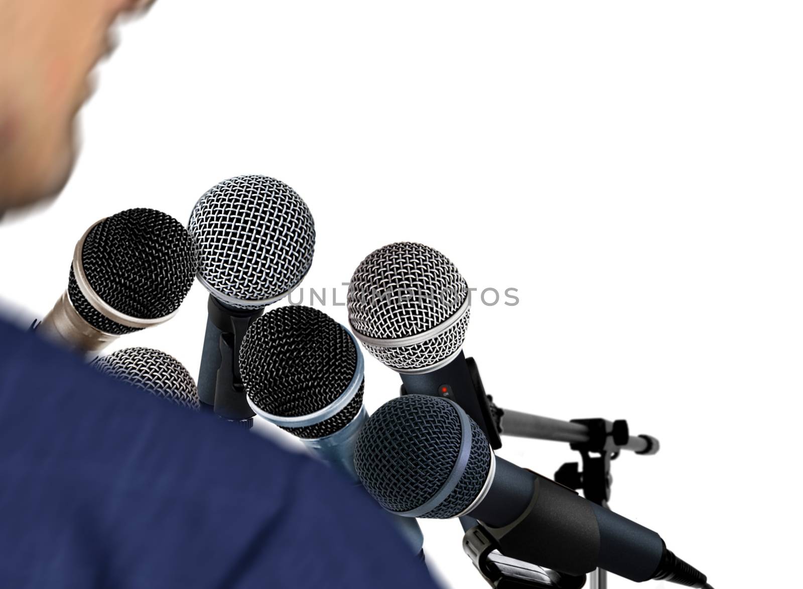 Man Giving Speech Using Microphones