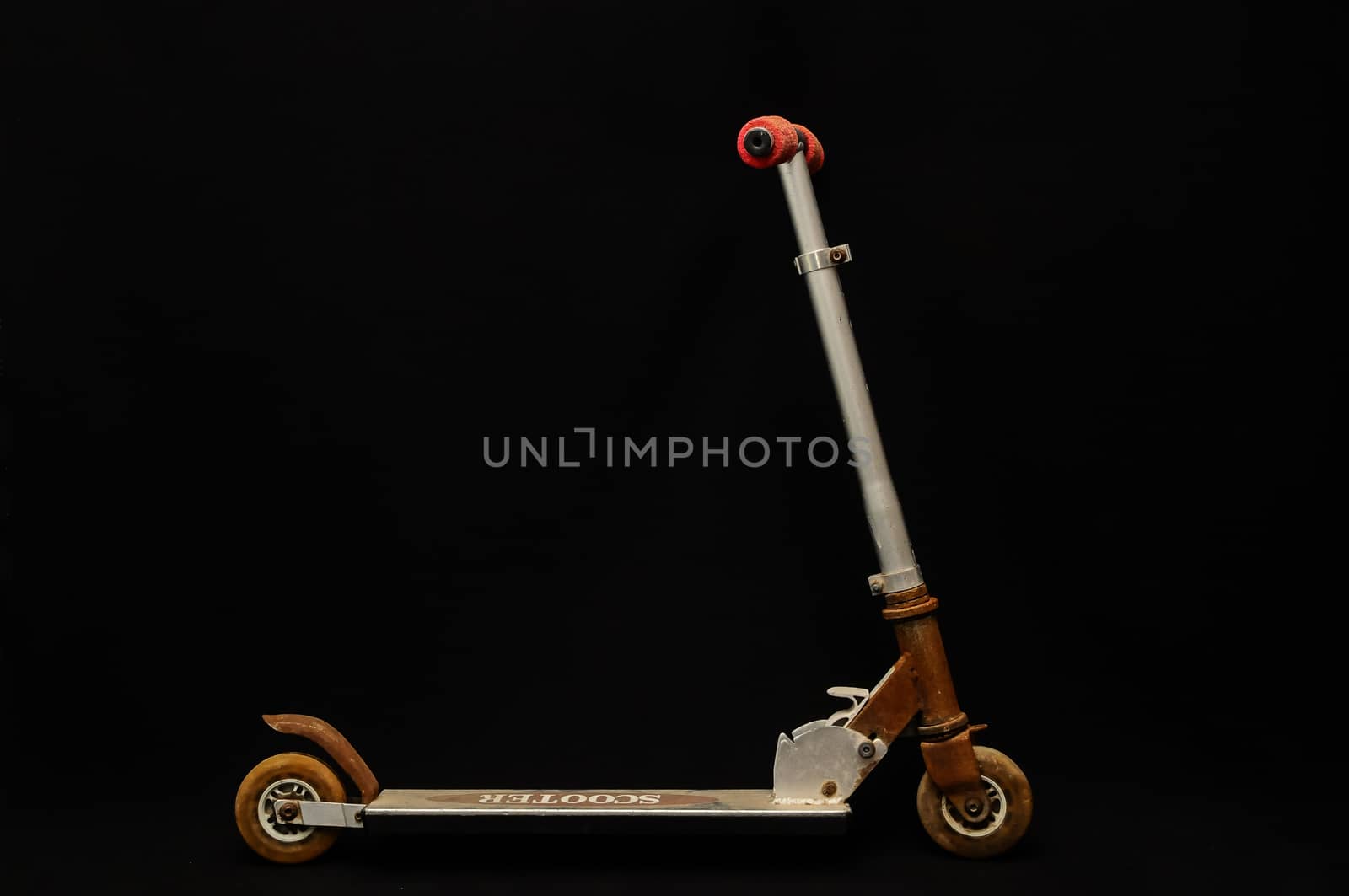 Metal scooter for child on white background