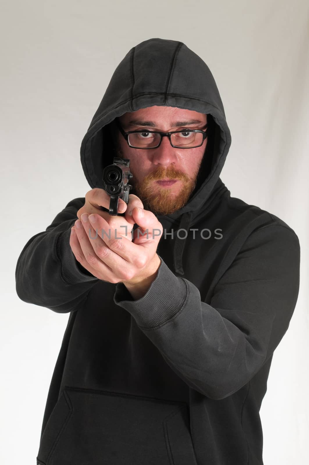 Black Dressed Young Man Holding a Pistol Gun