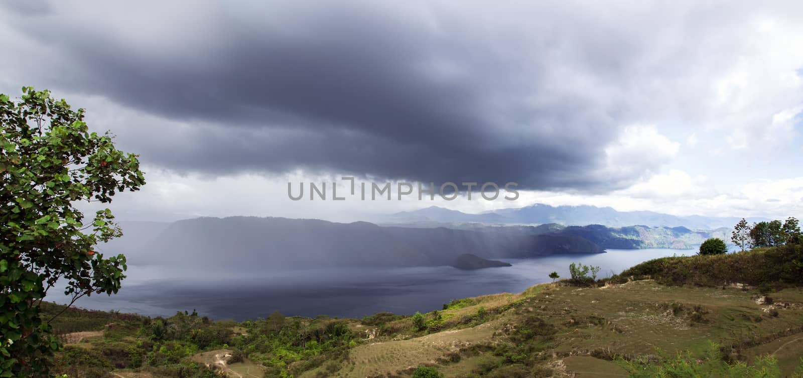 Rainfall over Lake Toba. Island on North Sumatra, Indonesia.