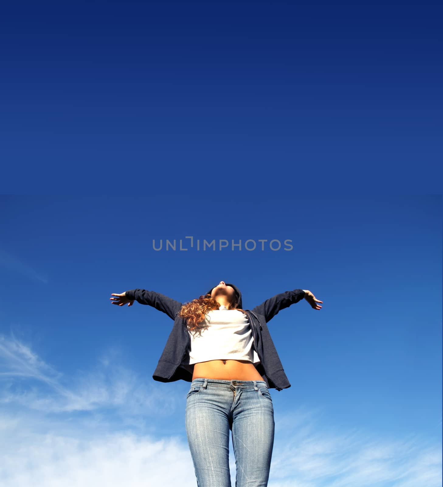 A young woman jumping in the Park.