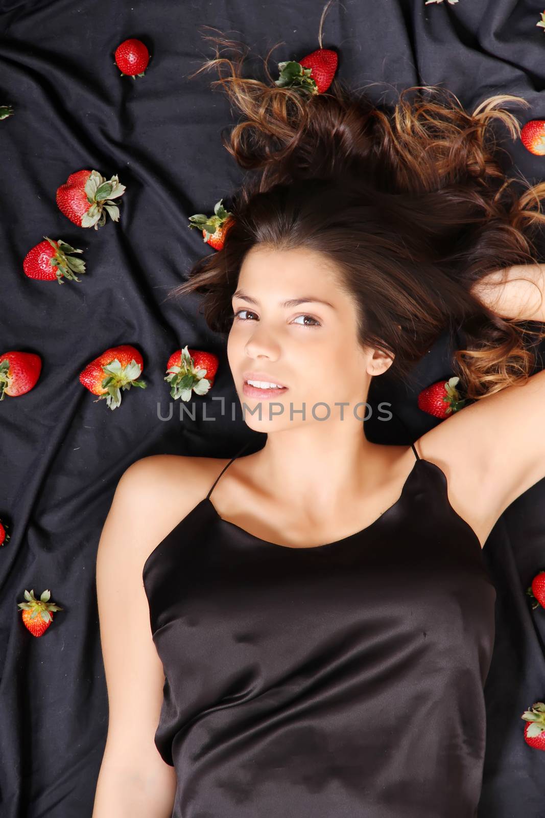 A young adult american woman dreaming of strawberries.