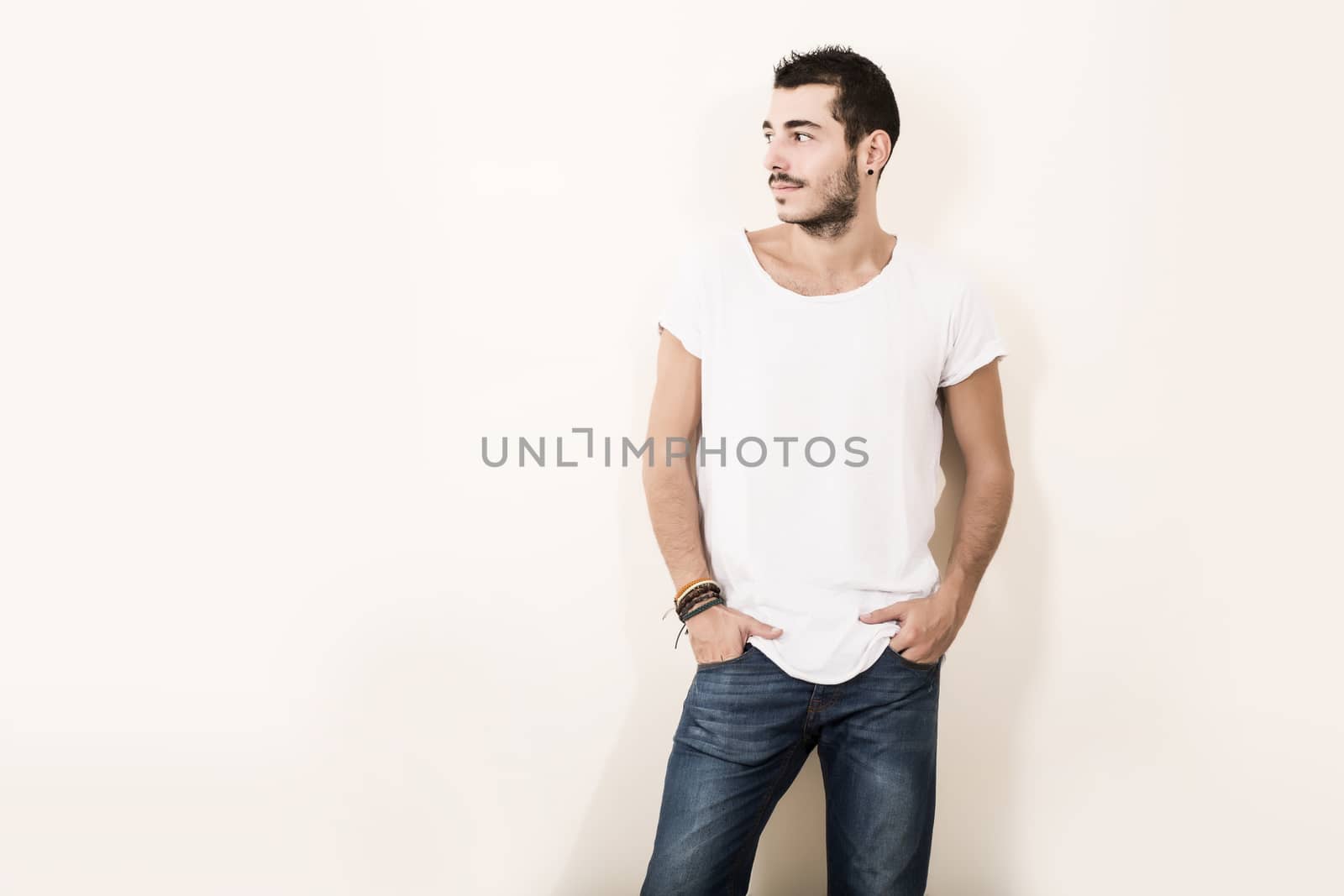 High Key Portrait of a relaxed latin man in casual clothes.