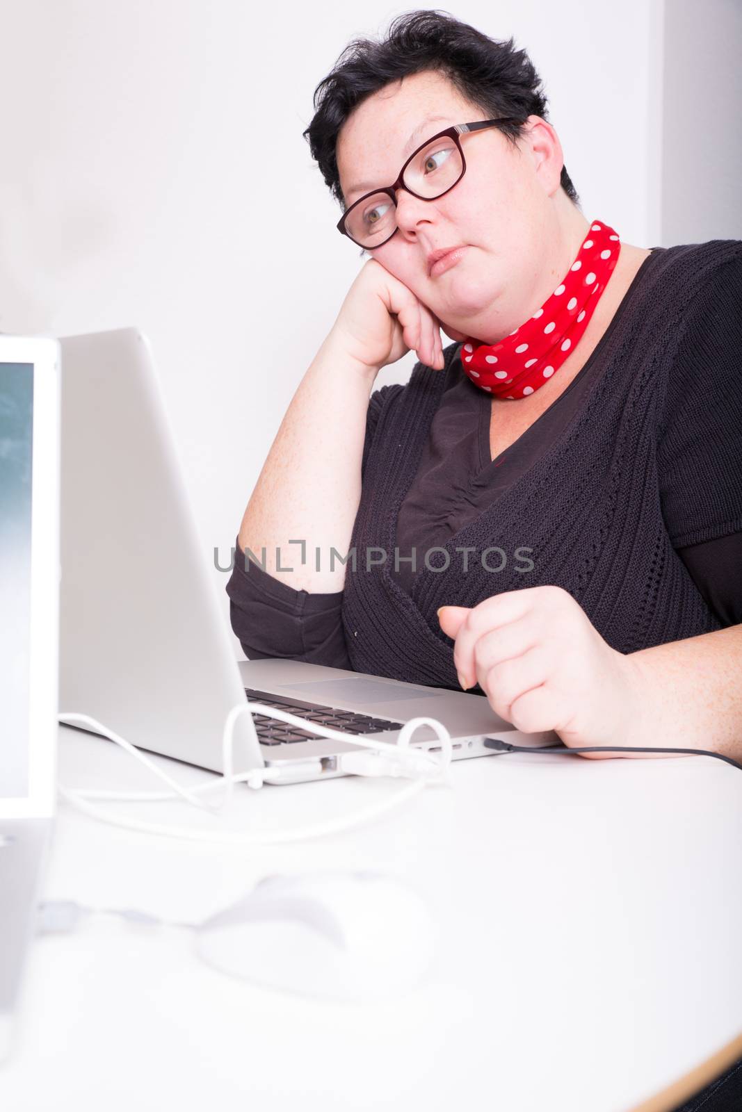 A bored woman in the office.