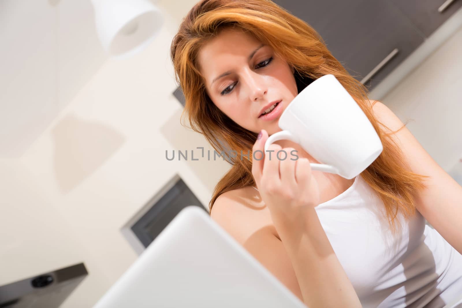 Redhead girl drinking cafe in kitchen by Spectral