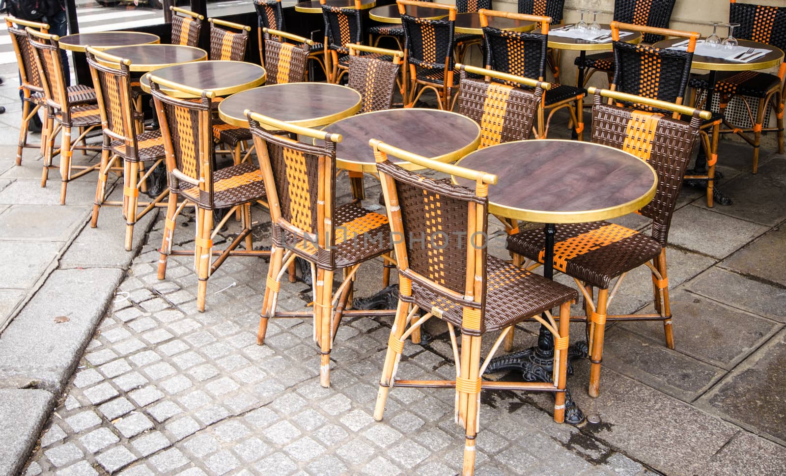 Chairs on the city street of Paris.