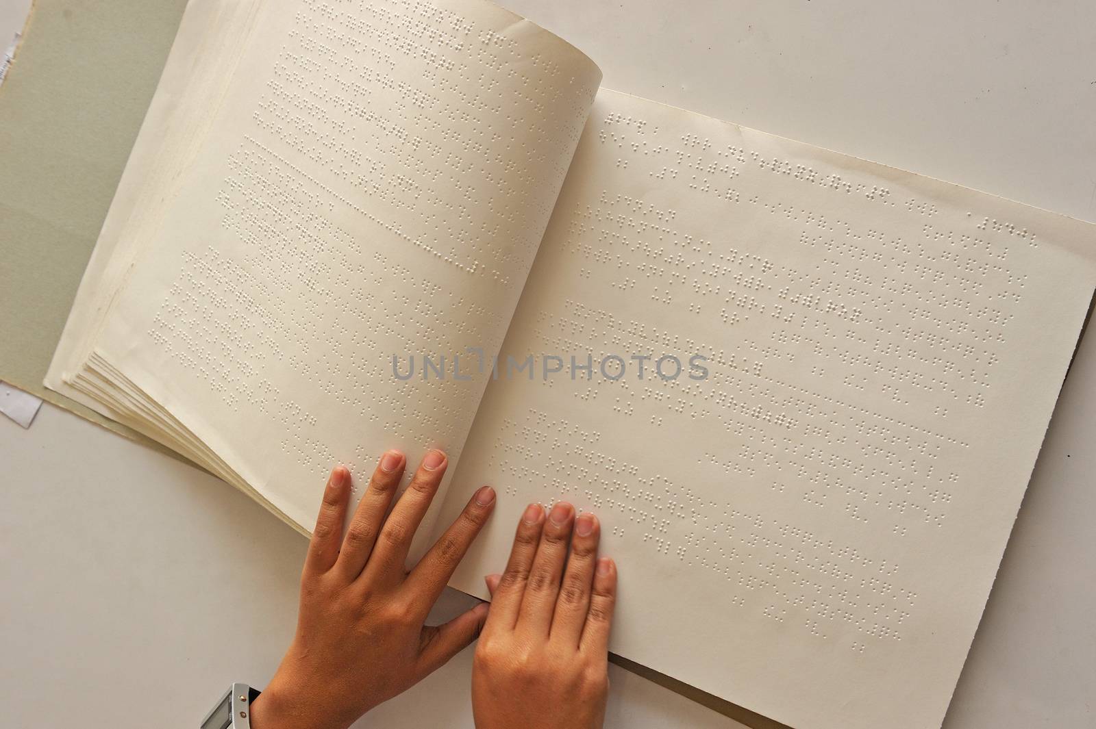 Reading the book Braille by think4photop