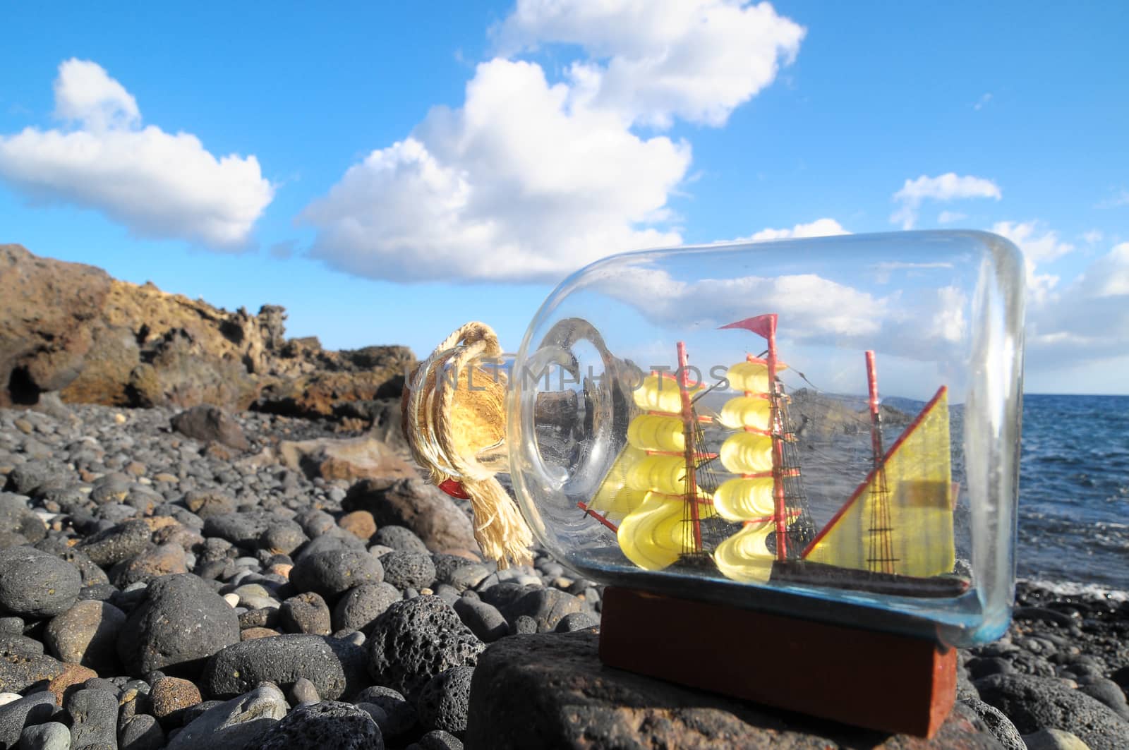 Ancient Spanish Sailing Boat in a Bottle near the Ocean