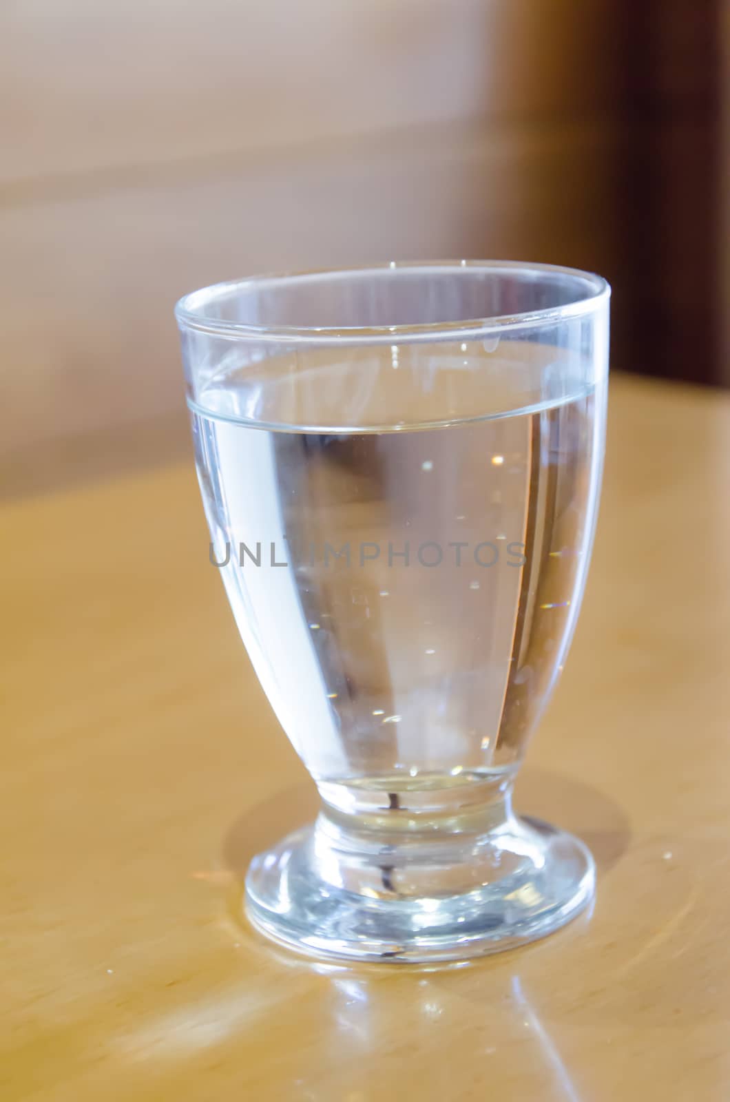 Water in a glass placed on the table.