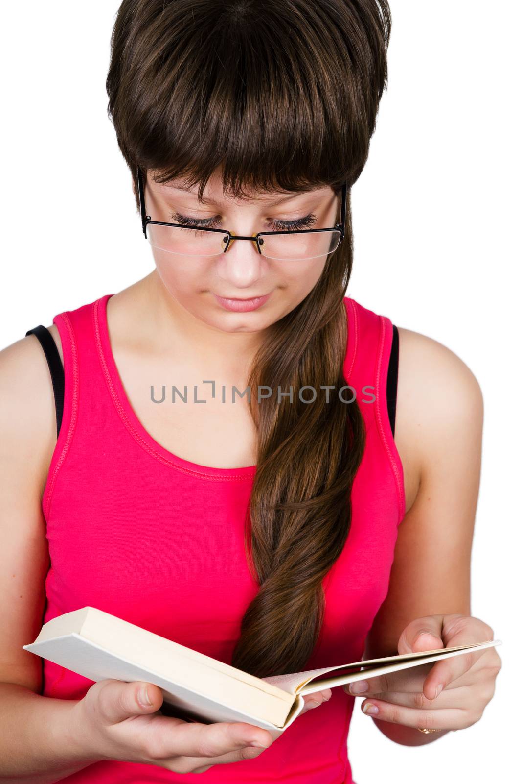 young beautiful girl with glasses reading a book. isolated on white background