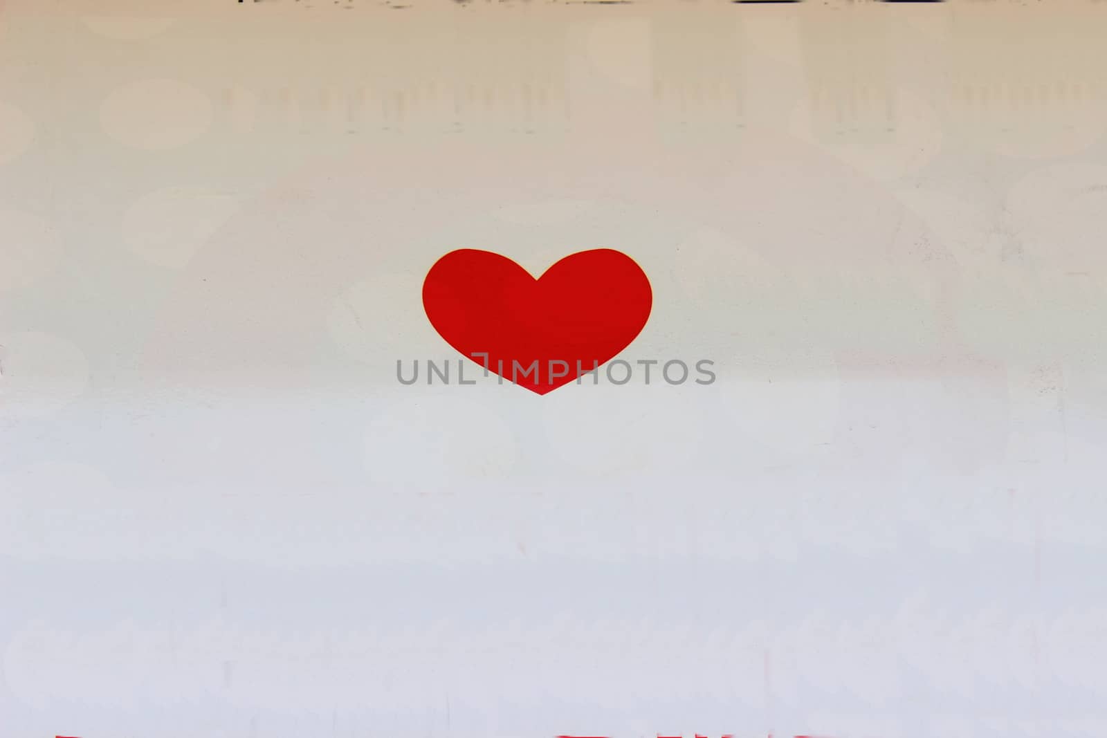 Shown on a white background red heart as a symbol of love