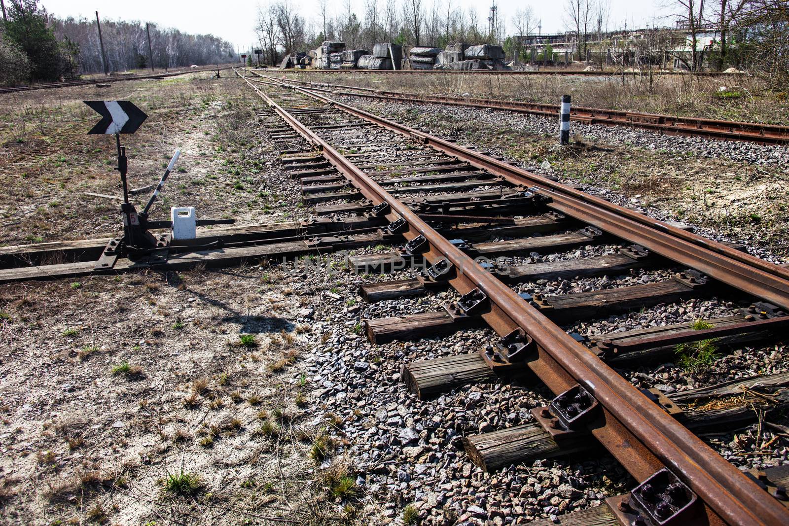 Old railroad tracks and railroad switch with point indicator