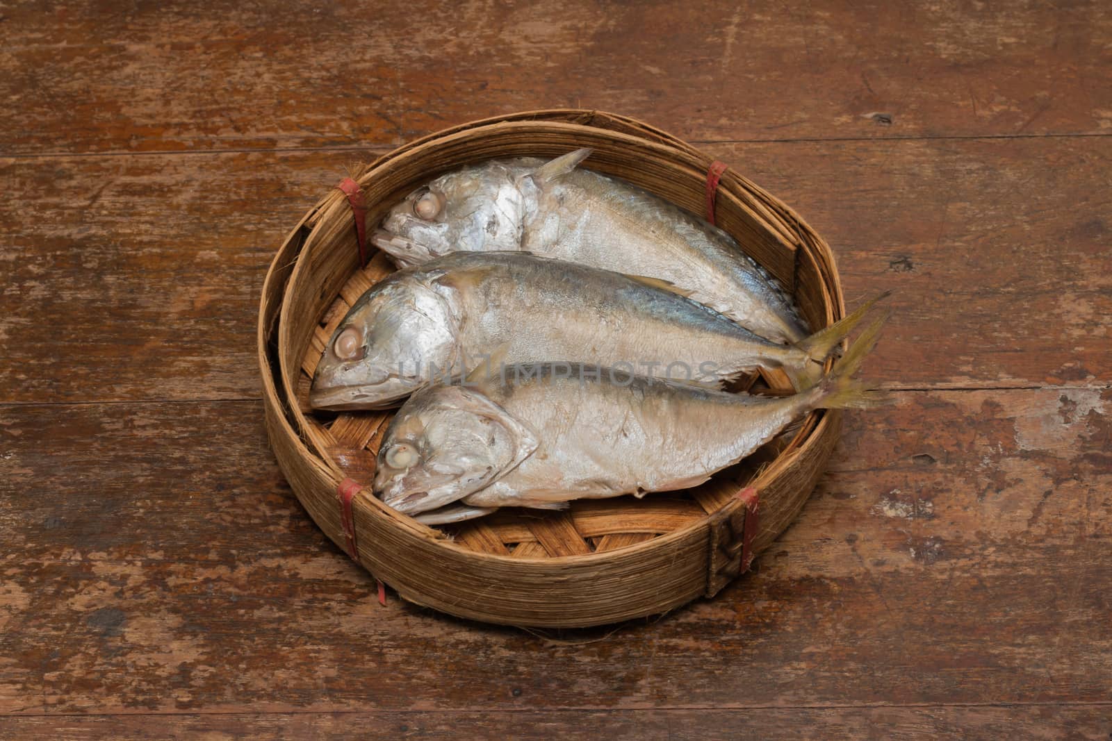 Mackerel fish in bamboo basket