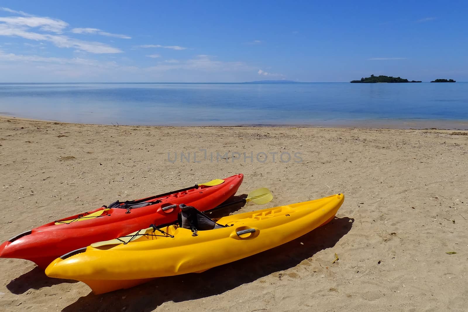 Colorful kayaks on a beach, Vanua Levu island, Fiji by donya_nedomam