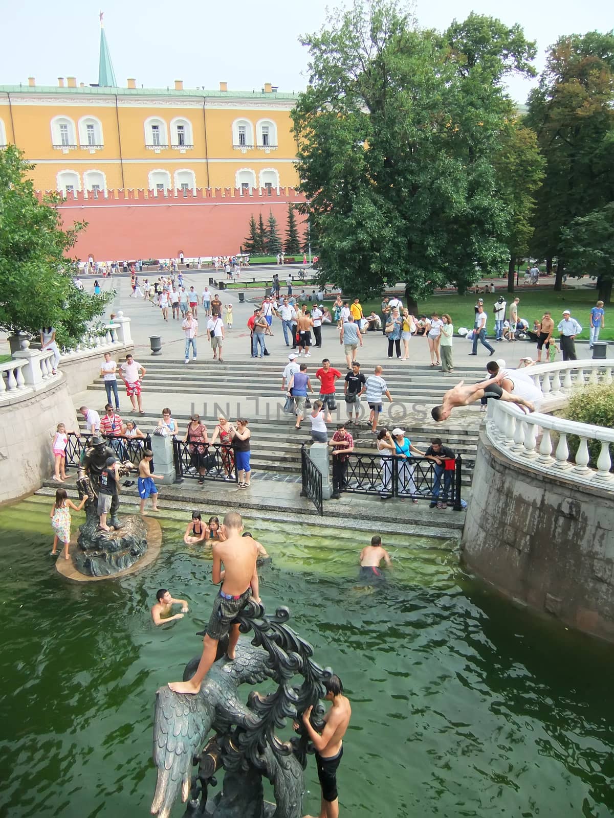 People swimming in a fountain, Alexander Gardens, Moscow, Russia by donya_nedomam