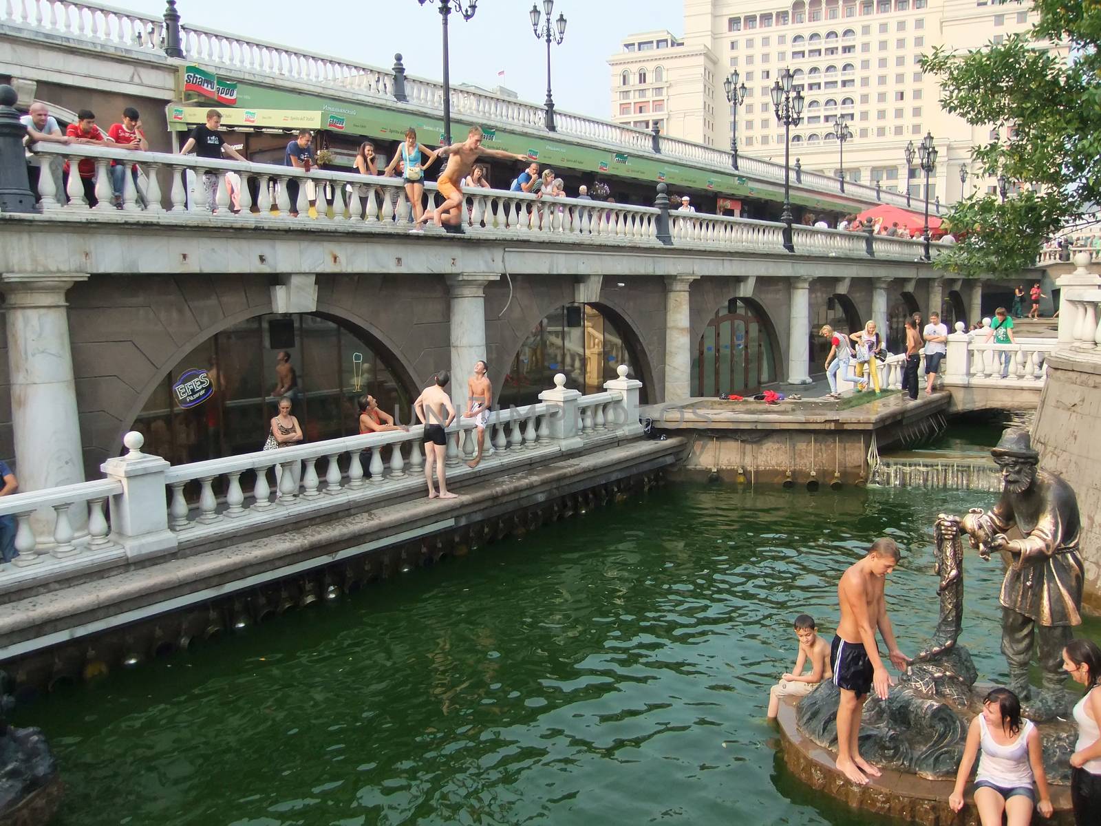 People swimming in a fountain, Alexander Gardens, Moscow, Russia