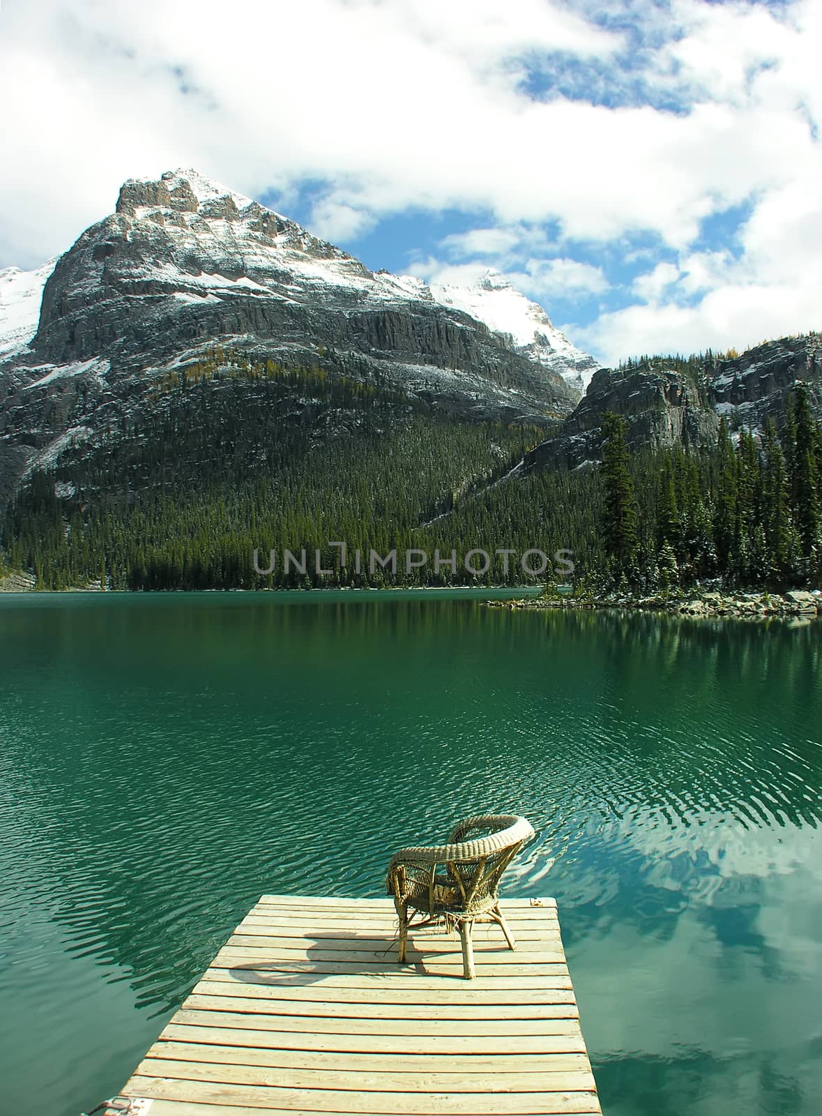 Chair on a wooden pier, Lake O'Hara, Yoho National Park, British Columbia, Canada