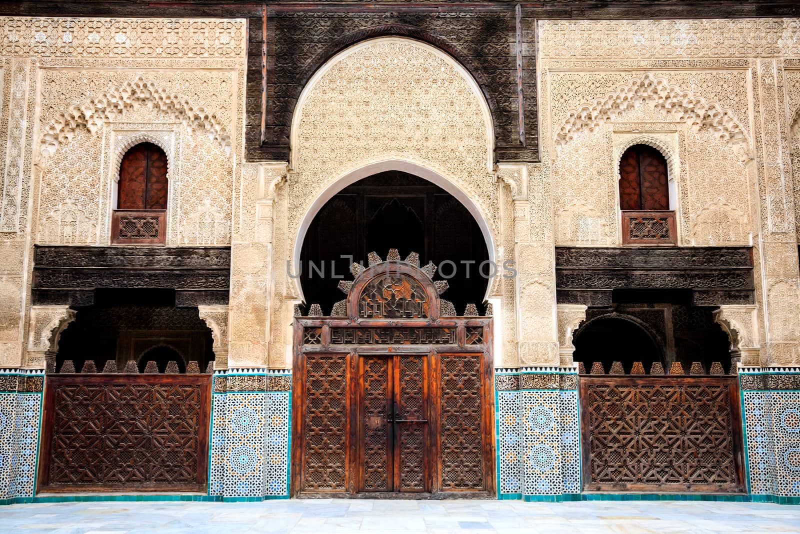 Delicate decoration at the courtyard of bou inania madrasa in ancient medina of fez in morocco