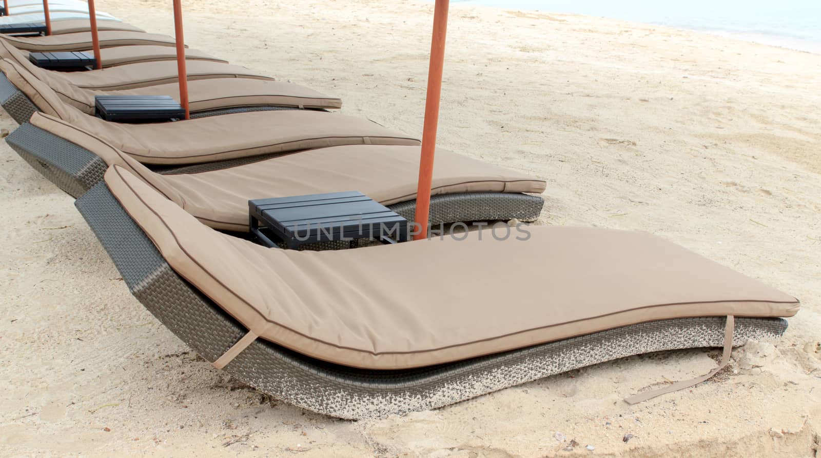 Beach bed that is surrounded by beautiful beaches.