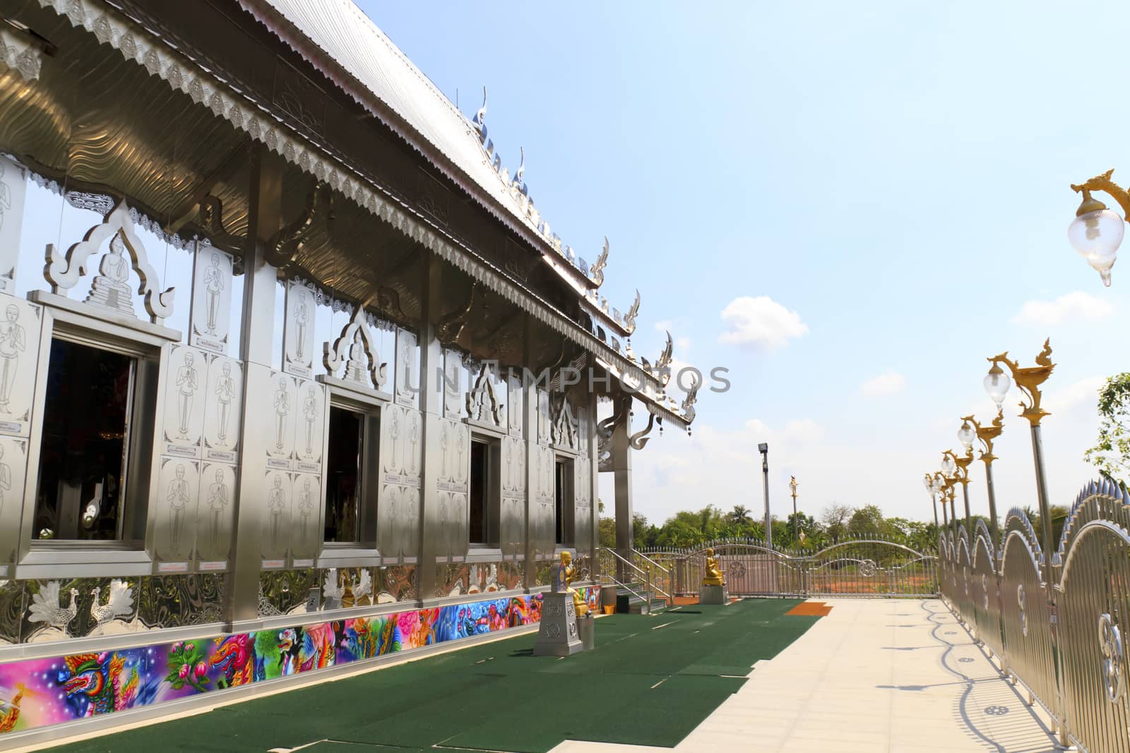 Stainless steel temple on clear blue sky in thailand.