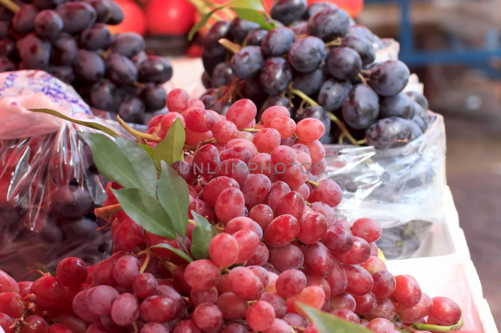 Purple and red grapes sale in the market.