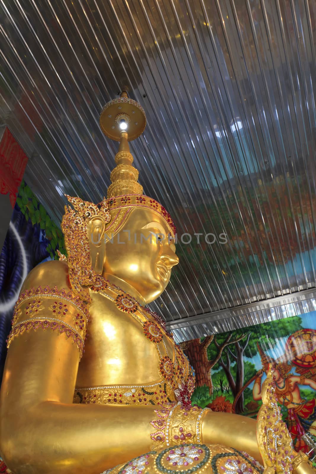 Statue of golden guardian at church of tainless steel temple, thailand.