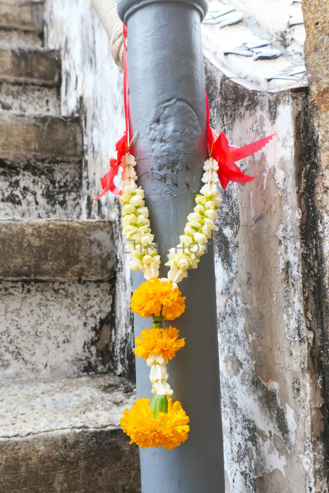 Thai jasmine garland for praying hanging on pole.