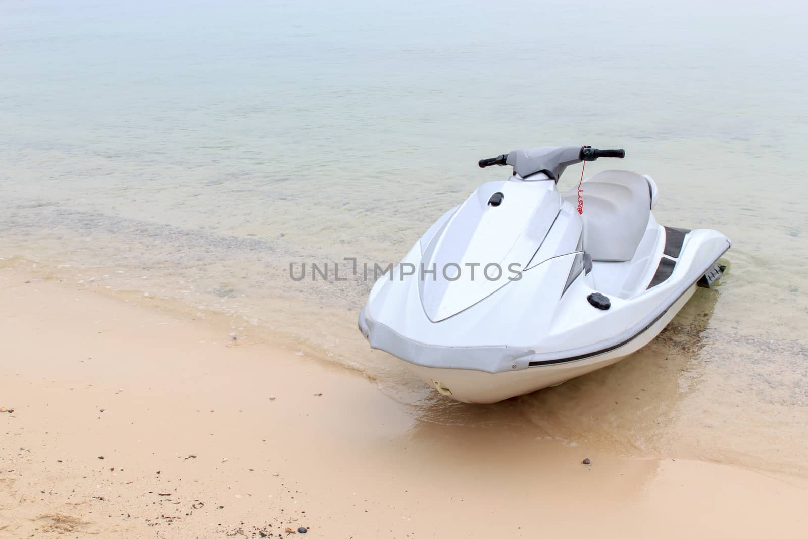 The jet ski parked on the beach.