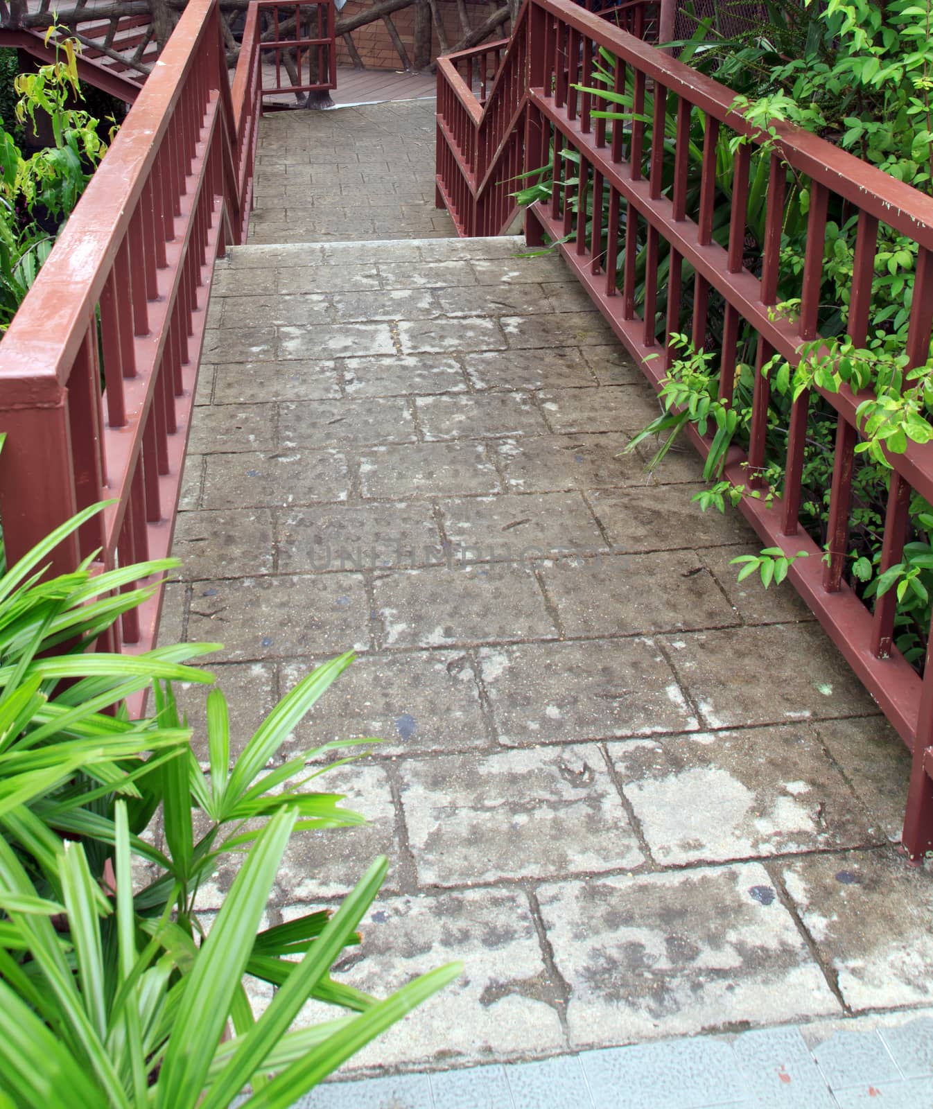 Pathway made ������of bricks in various colors at garden.