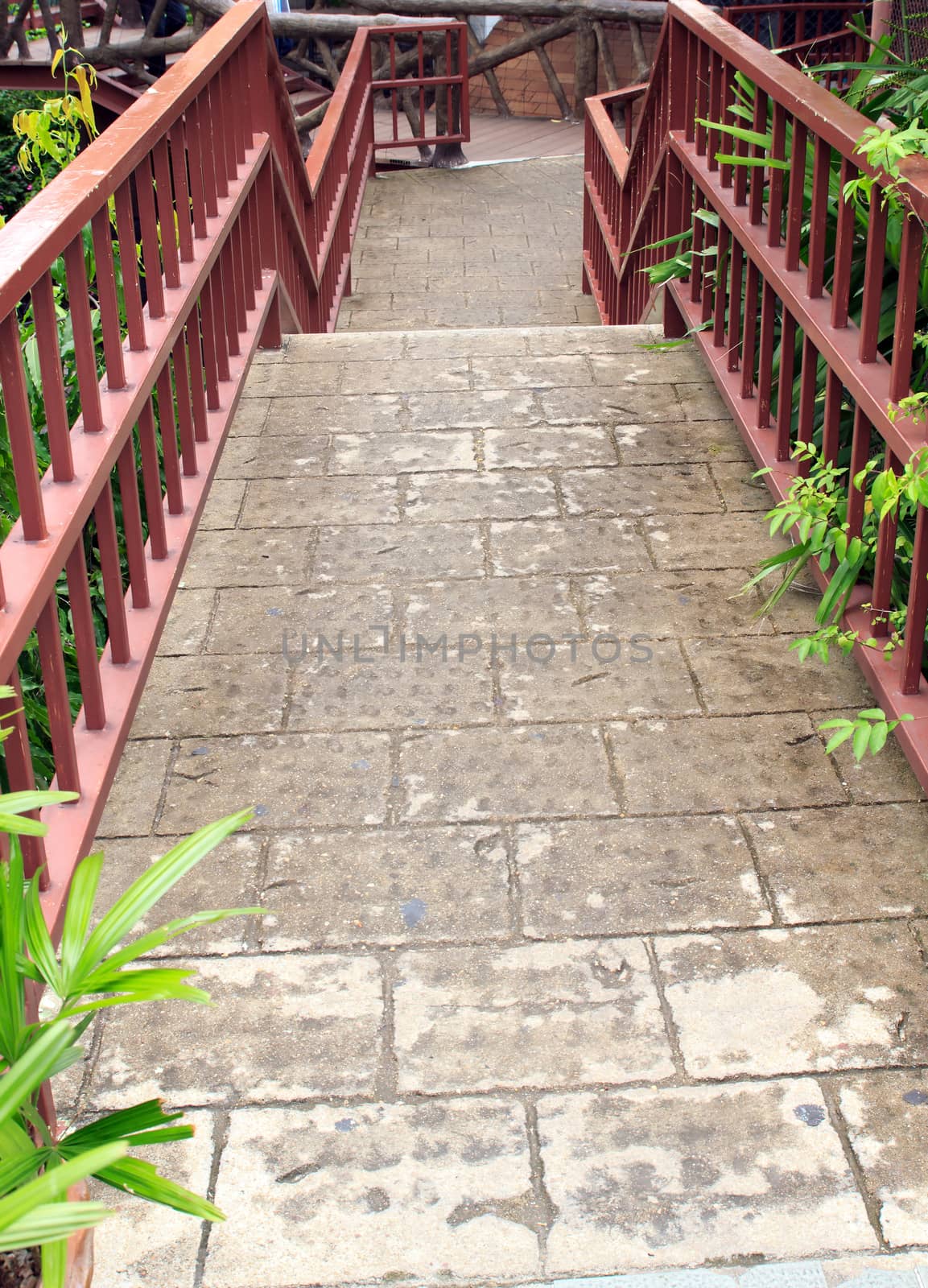 Pathway made ������of bricks in various colors at garden.